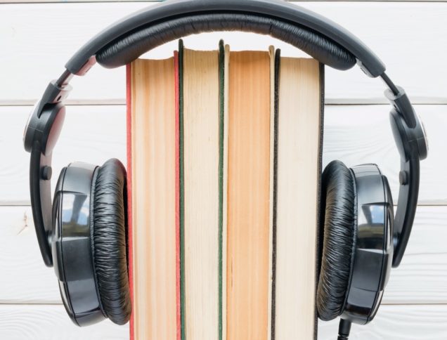 Headphones wrapped around books