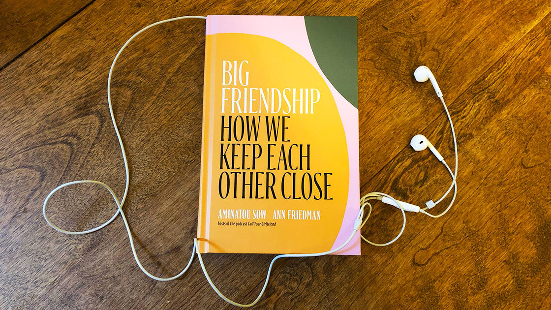 Big Friendship book on table with earbuds