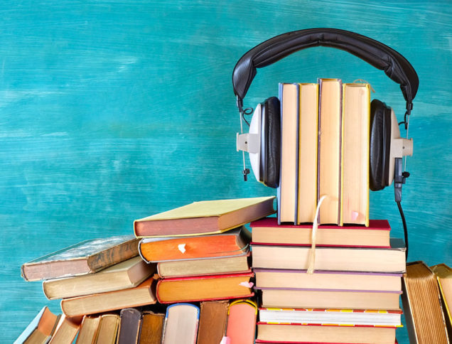 Headphones on a pile of books