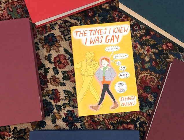 The Times I Knew I Was Gay book surrounded by books
